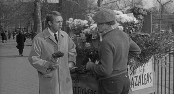Movie still from “Love with the Proper Stranger” (1963), directed by Robert Mulligan – Two men standing in front of a display of flowers; Medium shot, Over the shoulder angle