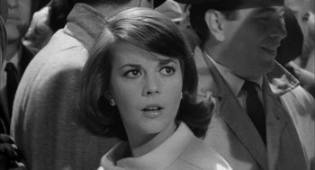 Movie still from “Love with the Proper Stranger” (1963), directed by Robert Mulligan – A black - and - white photo of a woman with a serious look on her face; Close Up shot, Low angle