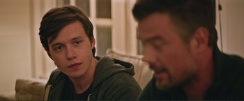 Movie still from “Love, Simon” (2018), directed by Greg Berlanti – Two men sitting in front of each other in a room; Close Up shot, Over the shoulder angle
