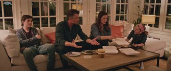 Movie still from “Love, Simon” (2018), directed by Greg Berlanti – A man and a woman sitting at a table; Wide shot, High angle