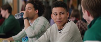 Movie still from “Love, Simon” (2018), directed by Greg Berlanti – A young man sitting in front of another young man; Close Up shot, Over the shoulder angle