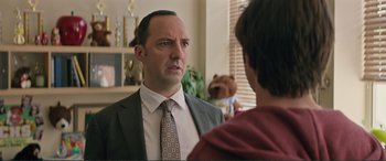 Movie still from “Love, Simon” (2018), directed by Greg Berlanti – A man wearing a suit and tie talking to a woman; Close Up shot, Over the shoulder angle