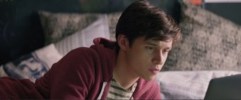 Movie still from “Love, Simon” (2018), directed by Greg Berlanti – A young man sitting on top of a couch; Close Up shot, Over the shoulder angle