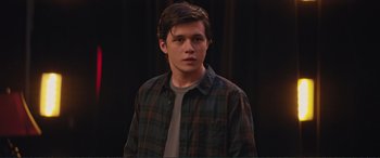 Movie still from “Love, Simon” (2018), directed by Greg Berlanti – A man in a plaid shirt is looking at the camera; Close Up shot, Over the shoulder angle
