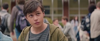 Movie still from “Love, Simon” (2018), directed by Greg Berlanti – A young man is looking into the distance; Close Up shot, Over the shoulder angle