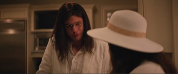 Movie still from “Love, Simon” (2018), directed by Greg Berlanti – A woman in a white shirt and a white hat; Close Up shot, Over the shoulder angle