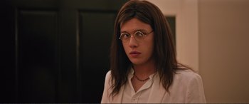 Movie still from “Love, Simon” (2018), directed by Greg Berlanti – A person with long brown hair wearing glasses; Close Up shot, Over the shoulder angle