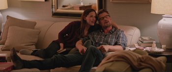 Movie still from “Love, Simon” (2018), directed by Greg Berlanti – A man and a woman sitting on a couch together; Medium shot, Over the shoulder angle