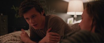 Movie still from “Love, Simon” (2018), directed by Greg Berlanti – A man laying on the ground in a room; Close Up shot, Over the shoulder angle