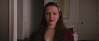 Movie still from “Love, Simon” (2018), directed by Greg Berlanti – A woman with long brown hair wearing a red shirt; Close Up shot, Over the shoulder angle