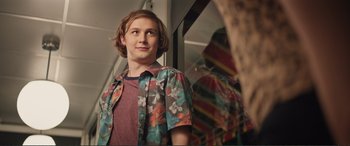 Movie still from “Love, Simon” (2018), directed by Greg Berlanti – A young man standing in front of a mirror; Close Up shot, Over the shoulder angle