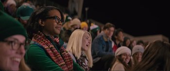 Movie still from “Love, Simon” (2018), directed by Greg Berlanti – A group of people sitting in a crowd watching a performance; Medium shot, Over the shoulder angle