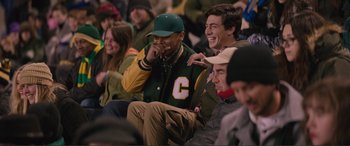 Movie still from “Love, Simon” (2018), directed by Greg Berlanti – A group of young men sitting next to each other in a stadium; Medium shot, Over the shoulder angle