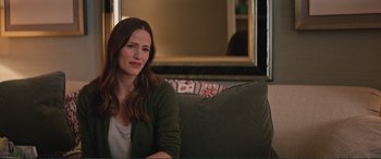 Movie still from “Love, Simon” (2018), directed by Greg Berlanti – A woman sitting on top of a couch in front of a mirror; Close Up shot, Over the shoulder angle