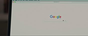 Movie still from “Love, Simon” (2018), directed by Greg Berlanti – A computer screen with a google logo on it; Extreme Close Up shot, High angle