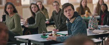 Movie still from “Love, Simon” (2018), directed by Greg Berlanti – A group of people sitting at a table with food on it; Medium shot, Over the shoulder angle