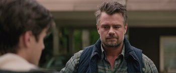 Movie still from “Love, Simon” (2018), directed by Greg Berlanti – A person wearing a plaid shirt; Close Up shot, Over the shoulder angle