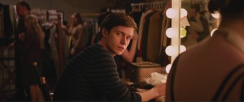 Movie still from “Love, Simon” (2018), directed by Greg Berlanti – A man sitting in front of a mirror in a dressing room; Medium shot, Over the shoulder angle