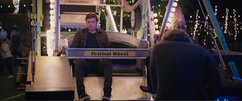 Movie still from “Love, Simon” (2018), directed by Greg Berlanti – A man sitting on a festival wheel seat; Medium shot, Over the shoulder angle
