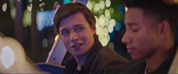 Movie still from “Love, Simon” (2018), directed by Greg Berlanti – A young man is smiling for the camera; Close Up shot, Over the shoulder angle
