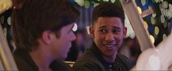 Movie still from “Love, Simon” (2018), directed by Greg Berlanti – Two young men sitting next to each other at a party; Close Up shot, Over the shoulder angle