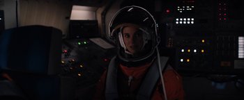 Movie still from “Lucy in the Sky” (2019), directed by Noah Hawley – A woman wearing a helmet in a space suit; Medium shot, Over the shoulder angle