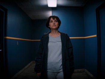 Movie still from “Lucy in the Sky” (2019), directed by Noah Hawley – A woman standing in a room with a yellow line on the wall; Medium shot, Low angle