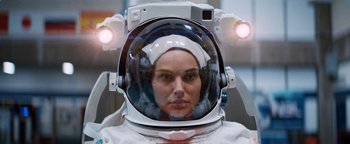 Movie still from “Lucy in the Sky” (2019), directed by Noah Hawley – A woman in a spacesuit with a helmet on her head; Close Up shot, Overhead angle