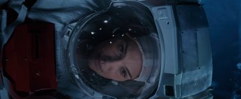 Movie still from “Lucy in the Sky” (2019), directed by Noah Hawley – A woman wearing a helmet in a space suit; Close Up shot, Overhead angle