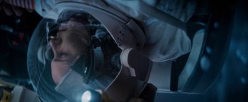 Movie still from “Lucy in the Sky” (2019), directed by Noah Hawley – View of a person wearing a helmet; Close Up shot, Overhead angle