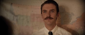 Movie still from “Lucy in the Sky” (2019), directed by Noah Hawley – A person wearing a shirt and tie; Close Up shot, Over the shoulder angle