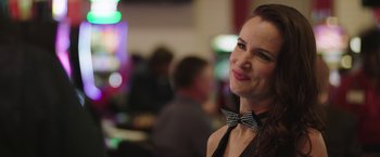 Movie still from “Ma” (2019), directed by Tate Taylor – A woman in a black dress and a bow tie; Close Up shot, Over the shoulder angle