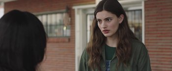 Movie still from “Ma” (2019), directed by Tate Taylor – A woman with long brown hair wearing a green jacket; Close Up shot, Over the shoulder angle