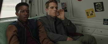 Movie still from “Ma” (2019), directed by Tate Taylor – A man sitting in a car holding a cell phone to his ear; Medium shot, Over the shoulder angle