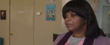 Movie still from “Ma” (2019), directed by Tate Taylor – A person wearing a scarf near a wall; Close Up shot, Over the shoulder angle