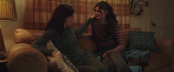 Movie still from “Ma” (2019), directed by Tate Taylor – Two women sitting on a couch talking to each other; Medium shot, Over the shoulder angle