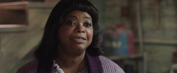 Movie still from “Ma” (2019), directed by Tate Taylor – An older woman wearing a purple sweater looking at the camera; Close Up shot, Over the shoulder angle