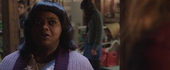 Movie still from “Ma” (2019), directed by Tate Taylor – A woman in a purple sweater is standing in a room; Close Up shot, Over the shoulder angle