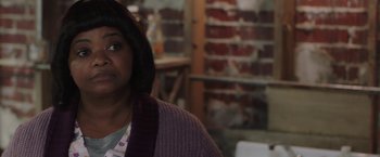 Movie still from “Ma” (2019), directed by Tate Taylor – A woman in a purple sweater is looking at the camera; Close Up shot, Over the shoulder angle