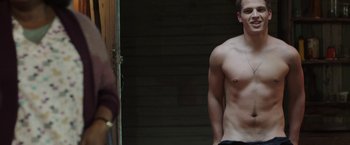 Movie still from “Ma” (2019), directed by Tate Taylor – A man standing in front of a mirror with his shirt off; Medium shot, Over the shoulder angle