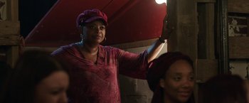 Movie still from “Ma” (2019), directed by Tate Taylor – A woman wearing a pink hat standing next to another woman; Close Up shot, Over the shoulder angle