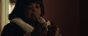 Movie still from “Ma” (2019), directed by Tate Taylor – A woman is holding a toothbrush in her mouth; Close Up shot, High angle