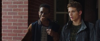 Movie still from “Ma” (2019), directed by Tate Taylor – Two young men standing next to each other in front of a brick wall; Close Up shot, Over the shoulder angle