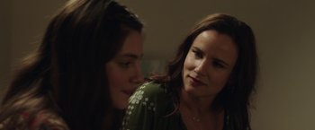Movie still from “Ma” (2019), directed by Tate Taylor – Two women sitting next to each other in a dark room; Close Up shot, Over the shoulder angle
