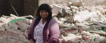 Movie still from “Ma” (2019), directed by Tate Taylor – A woman standing in front of a pile of rubble; Medium shot, Over the shoulder angle