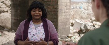 Movie still from “Ma” (2019), directed by Tate Taylor – A woman is standing in front of a pile of rubble; Medium shot, Over the shoulder angle