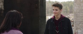 Movie still from “Ma” (2019), directed by Tate Taylor – A young man standing in front of a building; Close Up shot, Over the shoulder angle