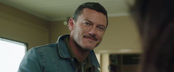 Movie still from “Ma” (2019), directed by Tate Taylor – A person wearing a jean jacket; Close Up shot, Over the shoulder angle