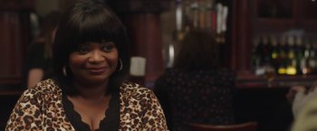 Movie still from “Ma” (2019), directed by Tate Taylor – A person wearing a leopard print shirt; Close Up shot, Over the shoulder angle