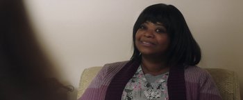 Movie still from “Ma” (2019), directed by Tate Taylor – A woman sitting in a chair wearing a sweater; Close Up shot, Over the shoulder angle